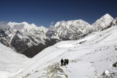 Trekkers trudging towards Bhimtang from Larkya La